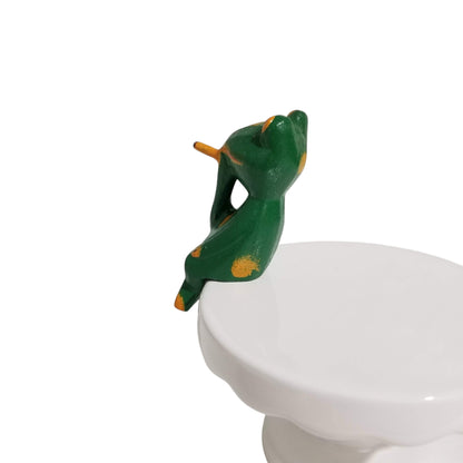 Relaxing frog figurine